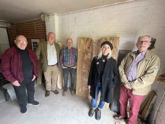 The carved memorial being finalised, with Dr Steve Jones, Cllr Ian Shipp, John Williams, Kate Jackson and Terry O'Donoghue